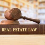 Real,Estate,Law,Books,And,A,Gavel,On,Desk,In